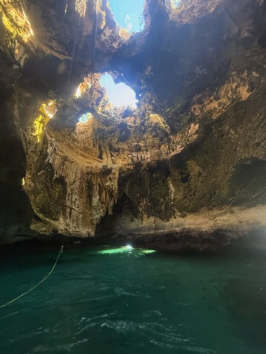 Light falling through the roof of a Bahamian sea cave