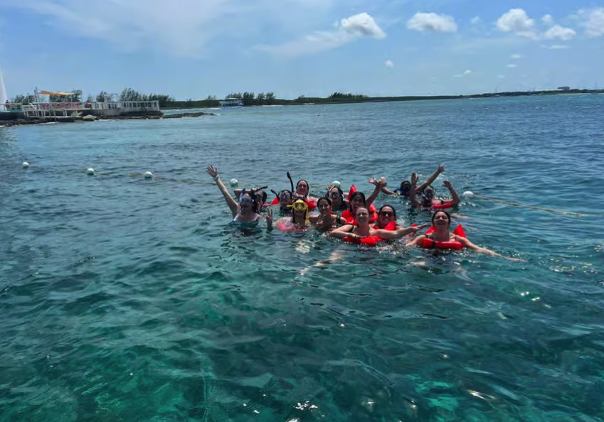 A snorkeling boat anchored over the reef off New Providence